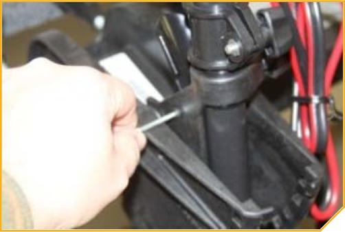 T-Bar_Replacement-_Tilt_Lever_Pin_being_pushed_into_position.png